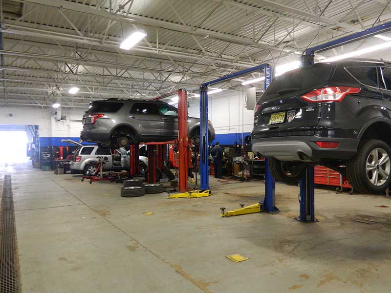 Cars on lifts getting repaired