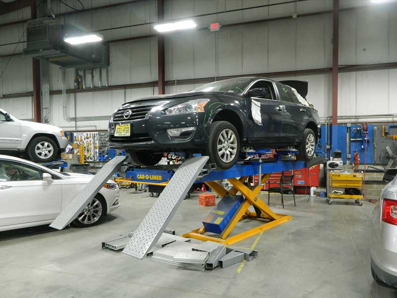A car lifted up getting repaired