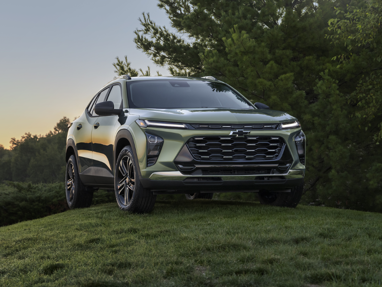 Green Chevy Sedan parked on loop