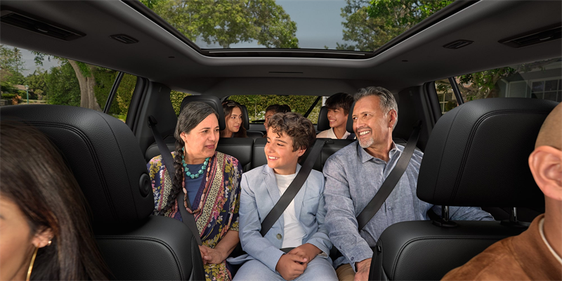 Family riding happily inside of a Chevrolet Traverse