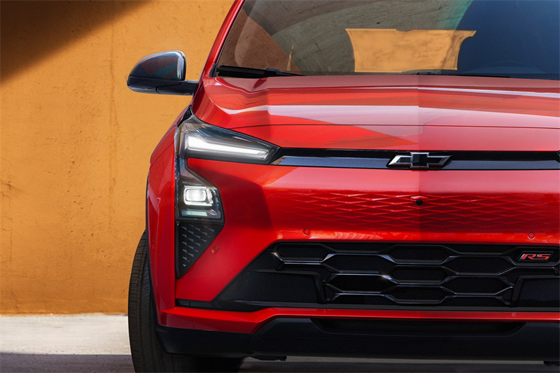 2027 Chevrolet Bolt EV showcasing its compact electric performance on the road